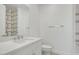 Bathroom featuring a modern vanity with a white countertop and decorative backsplash at 100 W Northern Ave # 7, Phoenix, AZ 85021