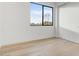 Bedroom featuring hardwood floors, window, and closet at 100 W Northern Ave # 7, Phoenix, AZ 85021