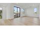 Bright bedroom with hardwood floors and large windows providing ample natural light at 100 W Northern Ave # 7, Phoenix, AZ 85021
