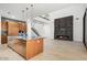 Gourmet kitchen with island, open to the living area with modern fireplace at 100 W Northern Ave # 7, Phoenix, AZ 85021