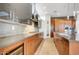 Gourmet kitchen with stainless steel appliances, wine storage and custom cabinets at 100 W Northern Ave # 7, Phoenix, AZ 85021
