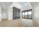 Bright and airy living room with high ceilings, hardwood floors, and fireplace at 100 W Northern Ave # 7, Phoenix, AZ 85021
