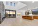 Expansive living area with fireplace and large windows with backyard views at 100 W Northern Ave # 7, Phoenix, AZ 85021