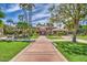 Stunning home exterior with lush landscaping, circular driveway, and grand entrance at 1010 N Osprey Ct, Gilbert, AZ 85234