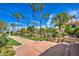 Beautifully landscaped grounds with palm trees, manicured lawns, and elegant pathways leading to resort-style amenities at 1010 N Osprey Ct, Gilbert, AZ 85234
