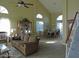 Expansive living room with vaulted ceilings, large windows, and elegant dining area at 1010 N Osprey Ct, Gilbert, AZ 85234