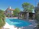 Inviting backyard pool with a pergola-covered patio area for relaxation and entertaining at 1010 N Osprey Ct, Gilbert, AZ 85234