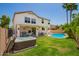 This backyard features a sparkling pool, inviting hot tub, and a covered patio at 1014 W Mulberry Dr, Chandler, AZ 85286