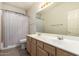 Bathroom with double sink vanity, cabinet storage, and shower with curtain at 1014 W Mulberry Dr, Chandler, AZ 85286