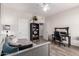 Bright bedroom featuring a ceiling fan, desk, and comfortable bed with stylish decor at 1014 W Mulberry Dr, Chandler, AZ 85286