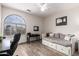 Bedroom features wood-look flooring, a work space, trundle bed, and large window at 1014 W Mulberry Dr, Chandler, AZ 85286