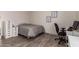 Neutral bedroom features wood-look flooring, white cabinets, and natural lighting at 1014 W Mulberry Dr, Chandler, AZ 85286