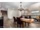 Elegant dining room with wood table, chandelier, and staircase access at 1014 W Mulberry Dr, Chandler, AZ 85286