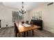 Cozy dining room featuring a wood table with leather chairs, and elegant chandelier at 1014 W Mulberry Dr, Chandler, AZ 85286