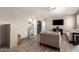Spacious living room with comfortable seating, wooden floors, and bright natural lighting at 1014 W Mulberry Dr, Chandler, AZ 85286