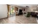 A spacious living room with wood floors, large windows, and access to the outdoor patio at 1014 W Mulberry Dr, Chandler, AZ 85286