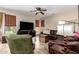 Comfortable living room featuring neutral paint, ceiling fan, and natural light at 1014 W Mulberry Dr, Chandler, AZ 85286