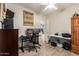 Well-lit office space with dual monitors, motivational art, and ample workspace at 1014 W Mulberry Dr, Chandler, AZ 85286