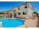 Backyard view showcasing a sparkling pool, covered patio, and the home's exterior at 1014 W Mulberry Dr, Chandler, AZ 85286