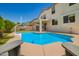Backyard view featuring a sparkling pool, patio area, and comfortable outdoor seating at 1014 W Mulberry Dr, Chandler, AZ 85286