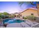 Lush backyard with a sparkling pool, lounge chairs, mature trees and BBQ at 10623 E Acacia Dr, Scottsdale, AZ 85255