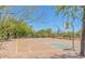 A well-maintained basketball court offers a recreational space surrounded by scenic landscaping at 10623 E Acacia Dr, Scottsdale, AZ 85255