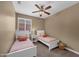 Cozy bedroom with two twin beds and a window with natural light at 10623 E Acacia Dr, Scottsdale, AZ 85255