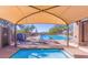 Community pool and spa area with lounge chairs and desert views at 10623 E Acacia Dr, Scottsdale, AZ 85255