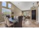 Elegant dining area featuring a modern chandelier and views of the outdoors at 10623 E Acacia Dr, Scottsdale, AZ 85255
