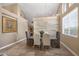 Dining room featuring a decorative wood accent wall and elegant chairs at 10623 E Acacia Dr, Scottsdale, AZ 85255