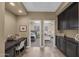 Hallway features a desk and black cabinets and leads to the bedrooms at 10623 E Acacia Dr, Scottsdale, AZ 85255