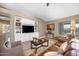 Comfortable living room with built-in shelving and a view of the backyard and the pool at 10623 E Acacia Dr, Scottsdale, AZ 85255