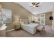 Spacious main bedroom with plush carpet, windows, and outdoor access at 10623 E Acacia Dr, Scottsdale, AZ 85255