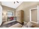 Inviting home office featuring a desk, armoire, and a comfortable sofa at 10623 E Acacia Dr, Scottsdale, AZ 85255