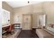 Comfortable home office with a desk, armoire, and sofa for relaxing at 10623 E Acacia Dr, Scottsdale, AZ 85255