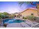 Backyard pool featuring desert landscaping, ample seating, a grill, mountain views, and patio at 10623 E Acacia Dr, Scottsdale, AZ 85255