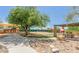 A recreational area offers diverse activities including a playground, basketball court, and picnic area at 10623 E Acacia Dr, Scottsdale, AZ 85255
