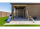 Backyard with a covered patio, playset and plenty of artificial grass at 10949 N 183Rd Dr, Surprise, AZ 85388
