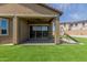 Backyard featuring artificial turf, covered patio, outdoor play equipment and fenced yard at 10949 N 183Rd Dr, Surprise, AZ 85388