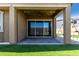Outdoor patio with ceiling fan and sliding glass doors, providing shade for outdoor seating at 10949 N 183Rd Dr, Surprise, AZ 85388