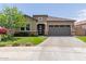 Charming single-Gathering home features a neutral color palette, well-maintained landscaping, and an attached garage at 10949 N 183Rd Dr, Surprise, AZ 85388