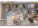 Well-organized garage featuring slat wall panels with various tools and equipment for storage at 10949 N 183Rd Dr, Surprise, AZ 85388