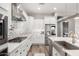 Spacious kitchen with stainless steel appliances, a large island, and white cabinetry at 10949 N 183Rd Dr, Surprise, AZ 85388