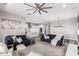 Open concept living area featuring a modern kitchen, two sofas, and wood flooring at 10949 N 183Rd Dr, Surprise, AZ 85388