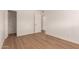 Bright bedroom with hardwood flooring and a closet at 1115 E Carter Dr, Tempe, AZ 85282
