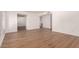 Bright living room with light wood floors and an open layout leading to the kitchen at 1115 E Carter Dr, Tempe, AZ 85282