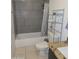 Cozy bathroom, featuring ceramic flooring, a bathtub and a toilet at 11770 W Aster Dr, El Mirage, AZ 85335