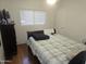 Comfortable bedroom with ample natural light and neutral decor at 11770 W Aster Dr, El Mirage, AZ 85335