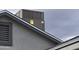 This is an angled view of the building's exterior featuring an HVAC unit on the roof at 11770 W Aster Dr, El Mirage, AZ 85335