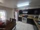 Well-equipped kitchen featuring stainless steel appliances and granite countertops at 11770 W Aster Dr, El Mirage, AZ 85335